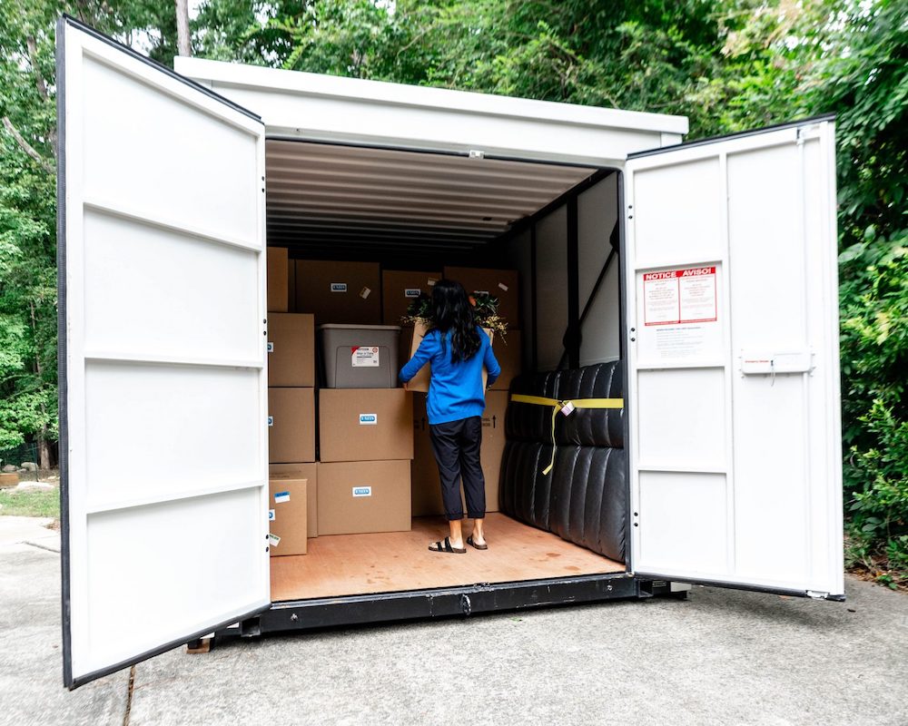 woman loads moving boxes into a container for portable storage in citrus heights, ca